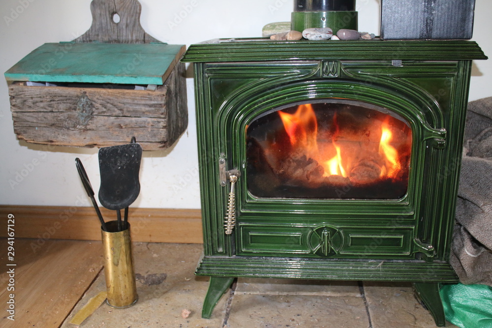 Close up of wood burning stove heater interior design in green enamel 1930  art deco antique