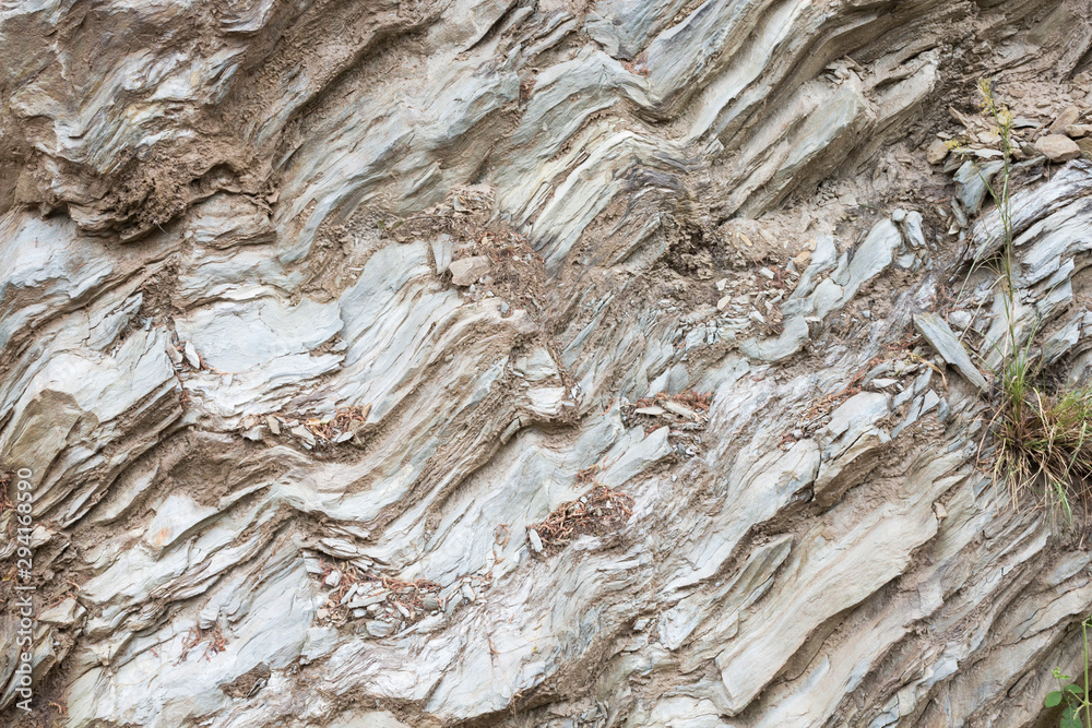 Beige layered rocks pattern, close-up