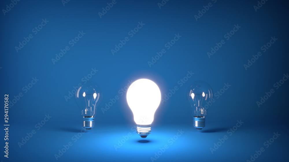 Glowing light bulb turned on with two light bulbs turned off in the blue background, with copyspace on the upper part of the image. For energy and ecology concepts. Glowing light bulb turned on with two light bulbs turned off in the blue background, with copyspace on the upper part of the image. For energy and ecology concepts.