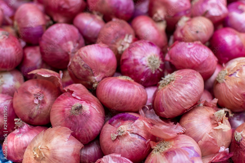 Young fresh red onion on market, new harvest, close up Young fresh red onion on market, new harvest, close up