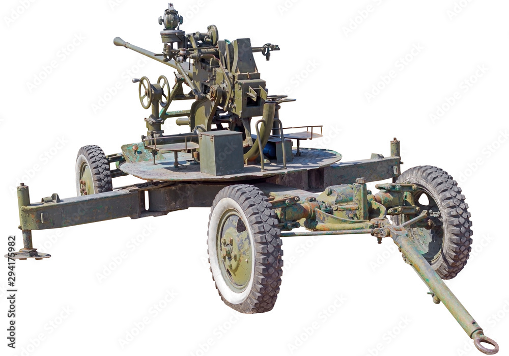 old anti-aircraft cannon on a white old anti-aircraft cannon on a white