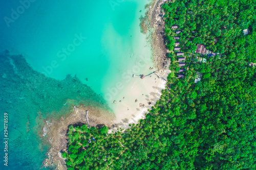 Turquoise sea water with beach on island green tropical forest
