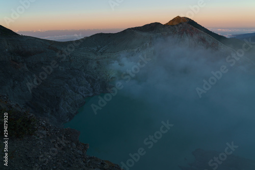 First light with fog. Sunrise on on the mountain Ijen Java ,Indonesia.