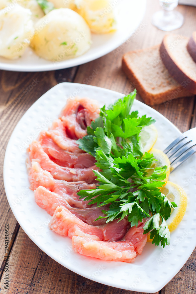 Homemade red salted fish on a white bowl, selective focus