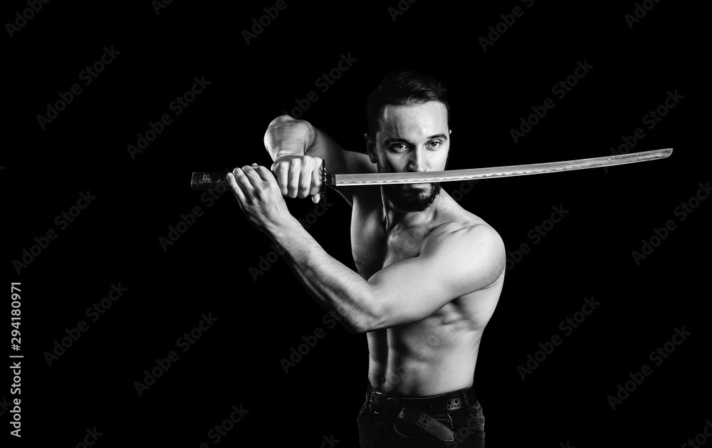 Ninja samurai warrior with naked torso in attack pose with katana sword. Black and white. Ninja samurai warrior with naked torso in attack pose with katana sword. Black and white.