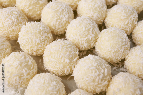 Round sweets with coconut. Raw handmade candy, healthy dessert.