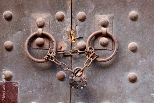 A medieval steel door that has been bolted shut. Access denied concept image. 