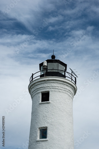 White Lighthouse against a Blue Sky