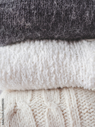 Pile of chunky winter sweaters.