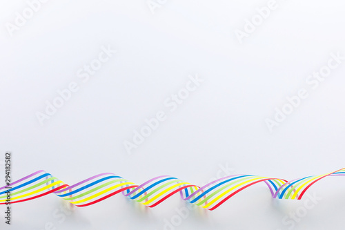 LGBT community pride rainbow ribbon awareness on white background.