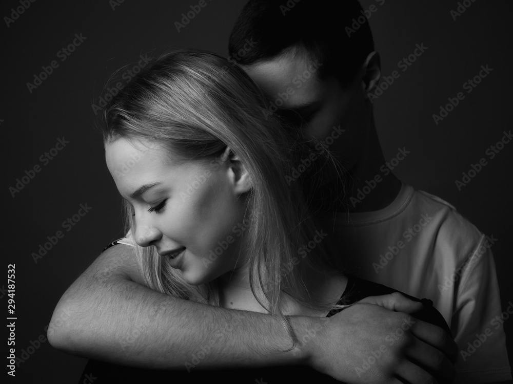 Portrait of young couple in studio. Black and white Portrait of young couple in studio. Black and white