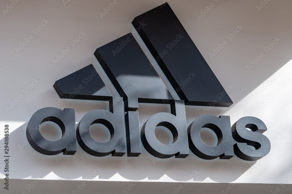 Adidas sign at a store in Sofia. Adidas AG is a German multinational  corporation Stock Photo | Adobe Stock