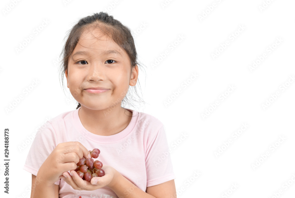 Little asian cute girl holding grapes and smile Little asian cute girl holding grapes and smile