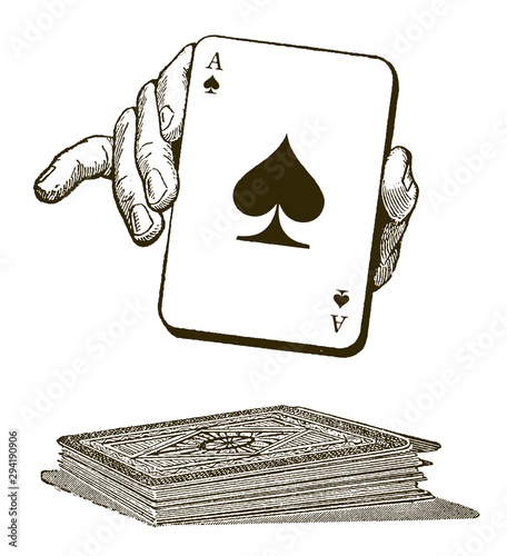 Human hand presenting an ace of spades playing card