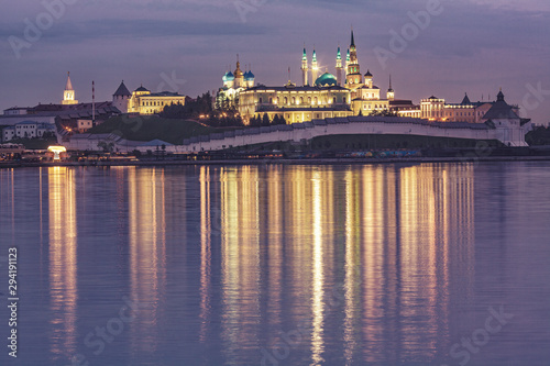 Kazan, Republic of Tatarstan, Russia. View of the Kazan Kremlin with Presidential Palace, Soyembika Tower, Annunciation Cathedral and Qolsharif Mosque from Kazanka River at evening