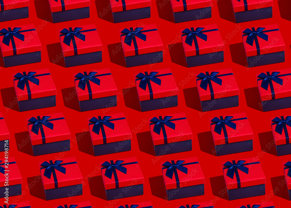 Gift box with red ribbon pattern on red background