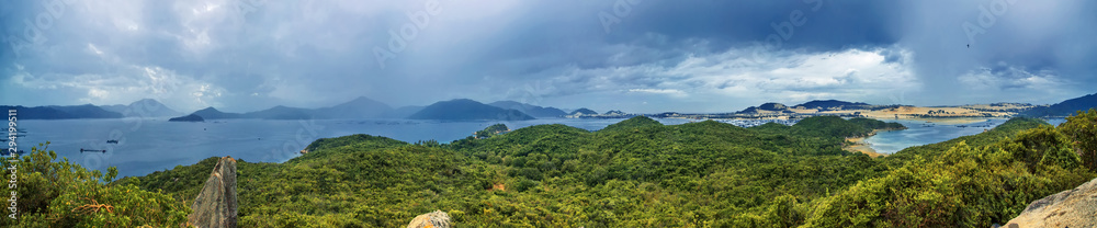 Panoramic view from whale island to the sea with fishing villages on the water and the mainland. Vietnam.