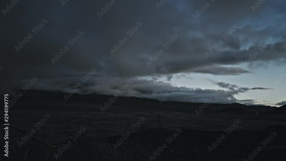 Aerial drone day-to-night time-lapse of the clouds forming over a field until it's dark Aerial drone day-to-night time-lapse of the clouds forming over a field until it's dark