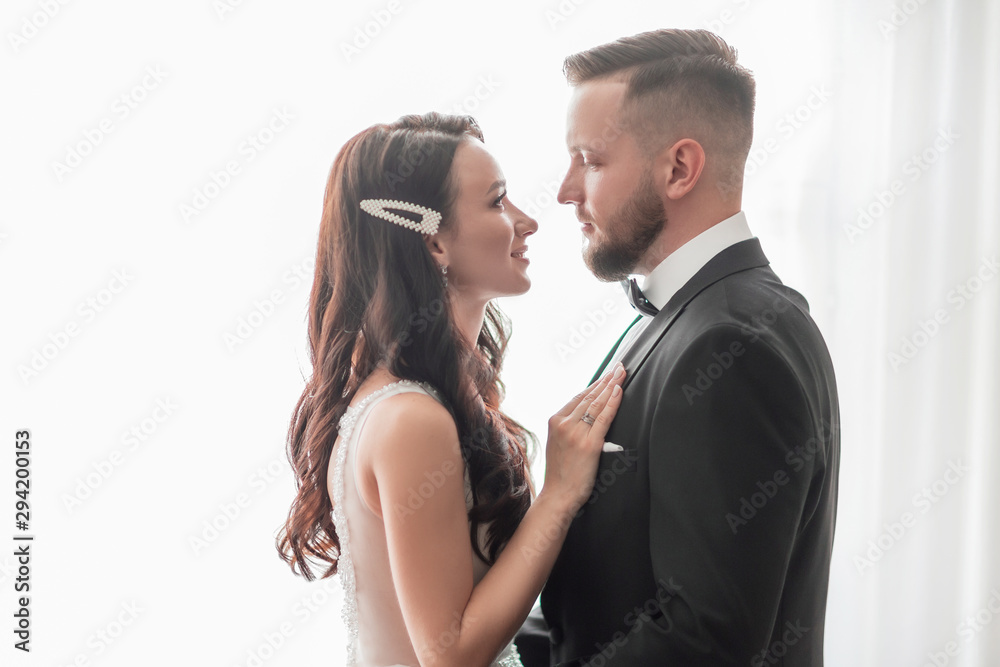 close up. happy bride and groom looking at each other close up. happy bride and groom looking at each other