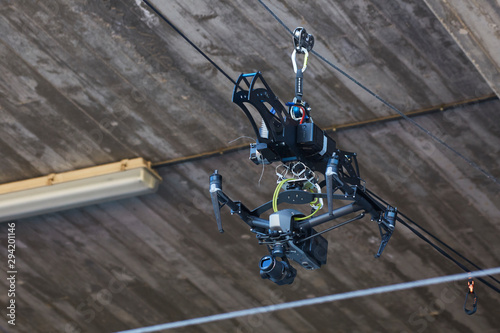 Camera hangs on cables for events photo