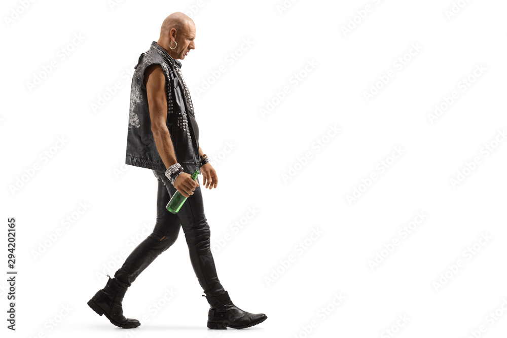Punker walking and holding a bottle of beer Punker walking and holding a bottle of beer