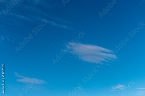 Blue sky with clouds as background, copy space, texture