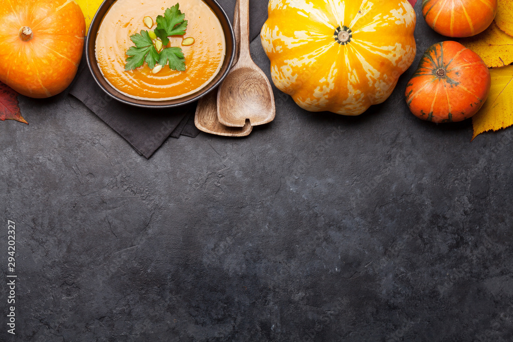 Pumpkin soup, pumpkins and autumn leaves Pumpkin soup, pumpkins and autumn leaves