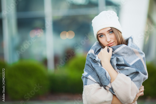 Cold and flu. Woman with flu outdoors dressed in cap