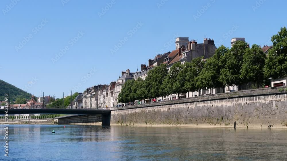 Famous view of Besançon. City center. Filmed in the summer, blue sky. Capital of the historical of Franche-Comté, in eastern France, Besançon is a tourist city. The city is crossed by the Doubs. Famous view of Besançon. City center. Filmed in the summer, blue sky. Capital of the historical of Franche-Comté, in eastern France, Besançon is a tourist city. The city is crossed by the Doubs.