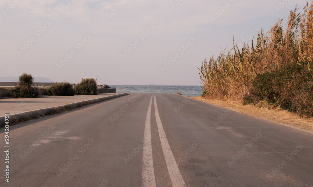 The road leading to the blue sea The road leading to the blue sea