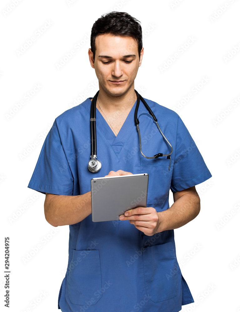 Male nurse using a digital tablet isolated on white Male nurse using a digital tablet isolated on white
