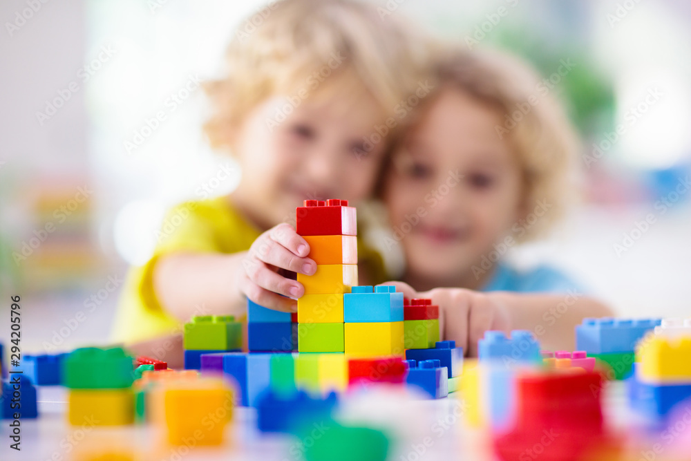 Child playing with toy blocks. Toys for kids. - obrazy, fototapety, plakaty 