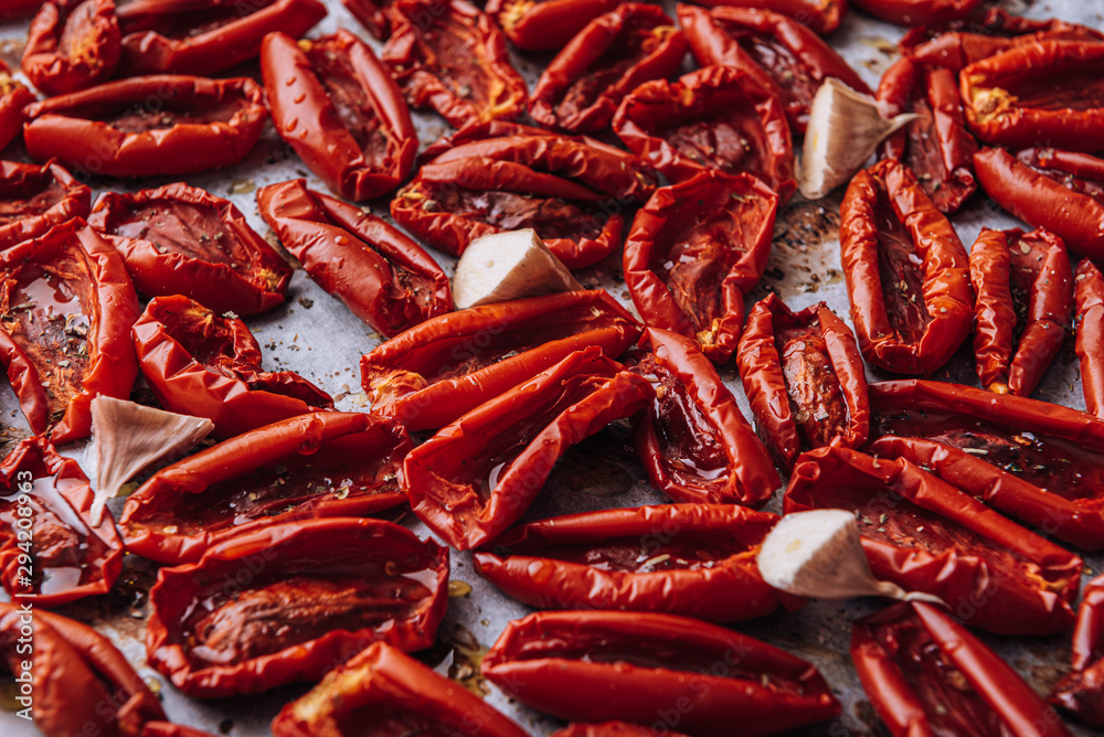 traditional italian food, sun-dried tomatoes made at home. traditional italian food, sun-dried tomatoes made at home.