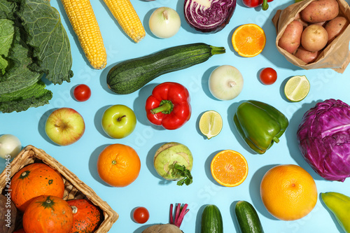 Fototapeta Naklejka Na Ścianę i Meble -  Different vegetables and fruits on blue background, top view