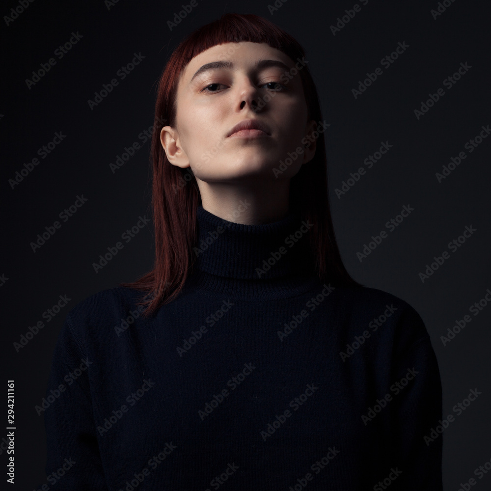 Portrait of serious woman in black swater. Portrait of serious woman in black swater.