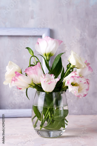 Wallpaper Mural Eustoma flowers in vase on table near stone wall, space for text. Blank for postcards Torontodigital.ca