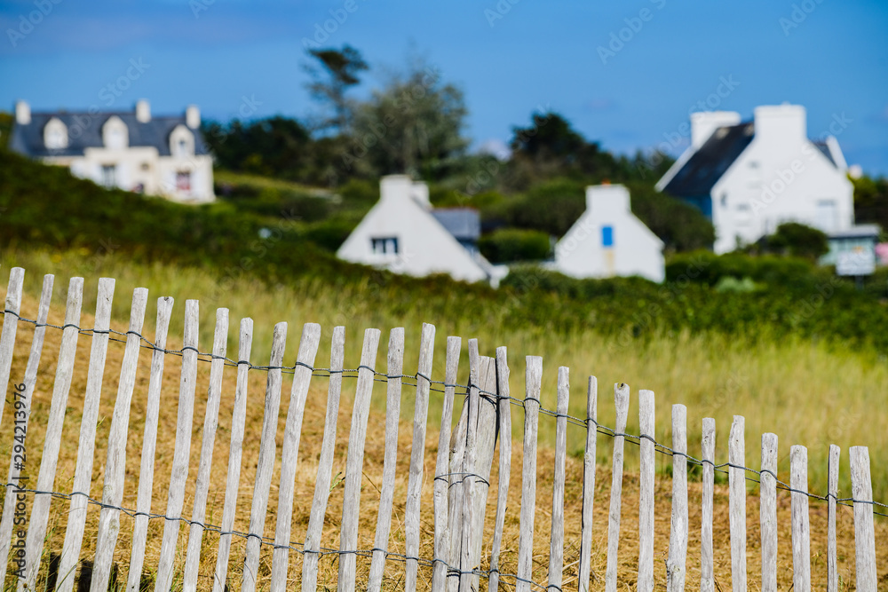 Fototapeta premium Breton houses behind a wooden fence, creative photography. Finister. Brittany. France