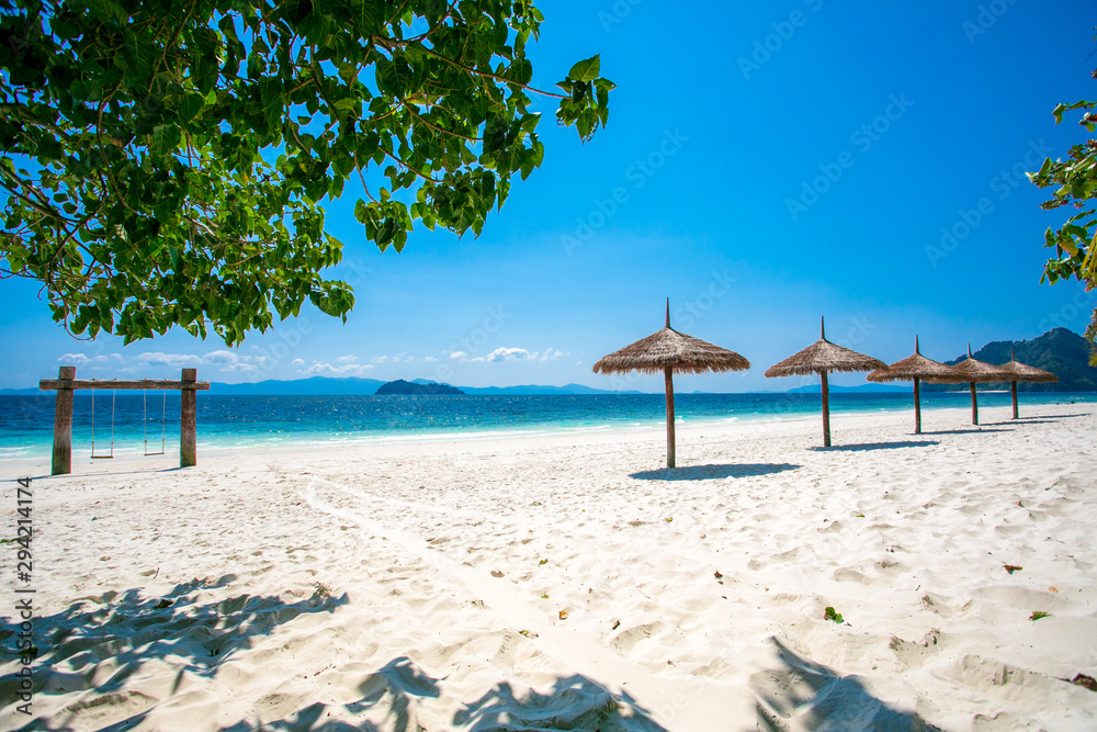 Fototapeta premium Umbrella wooden on tropical beach.