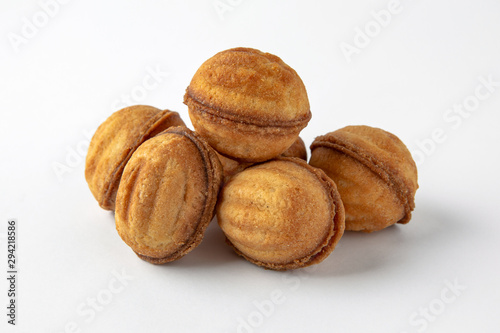 Tasty crunchy cookie: oatmeal, shortbread, chocolate, nutty, honey. Close-up isolated on a white background