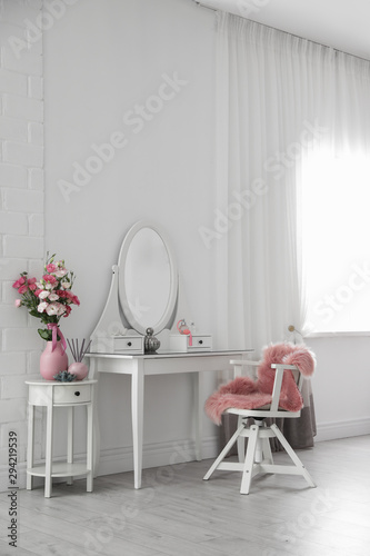Stylish room interior with white dressing table © New Africa