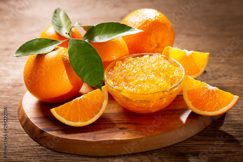 Fototapeta Naklejka Na Ścianę i Meble -  bowl of orange jam with fresh fruits