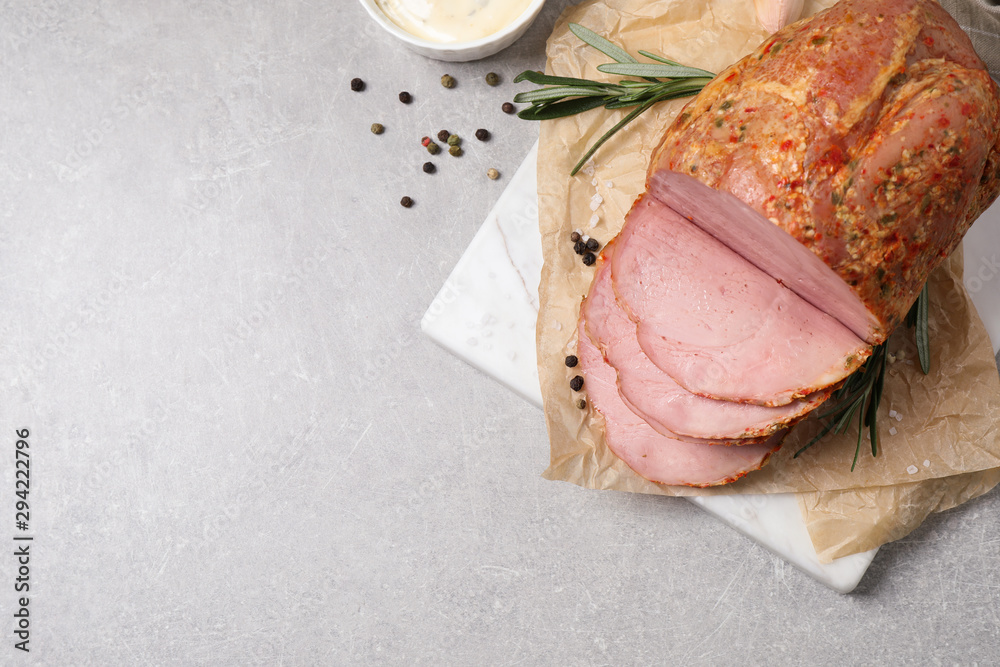 Delicious ham served on grey table, flat lay. Space for text Delicious ham served on grey table, flat lay. Space for text