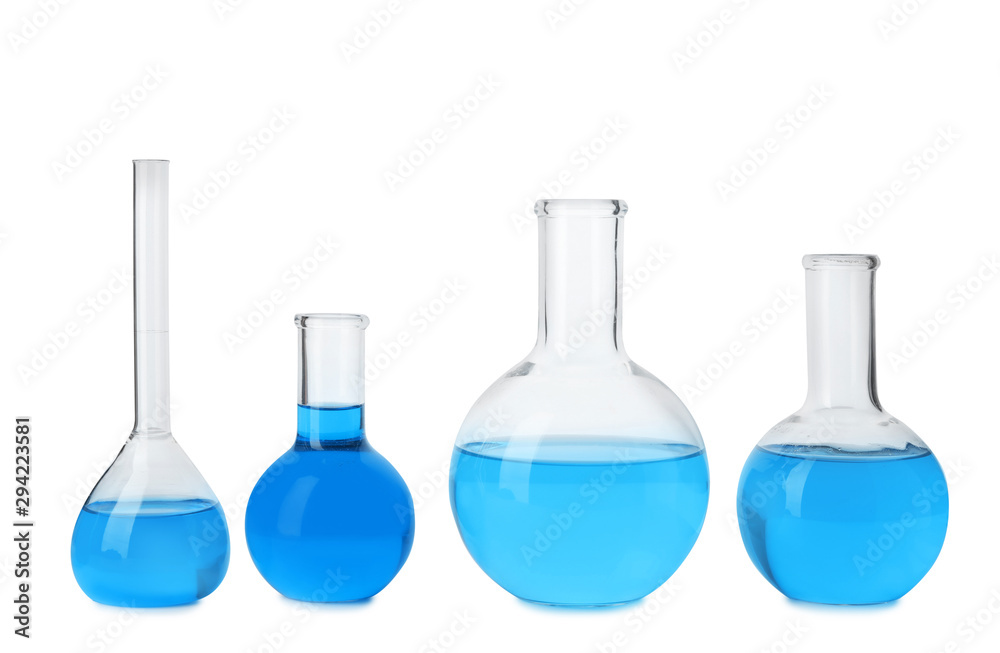 Laboratory glassware with blue liquids isolated on white Laboratory glassware with blue liquids isolated on white