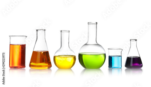 Laboratory glassware with color liquids on white background