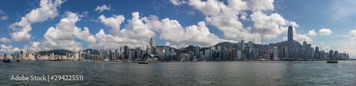 Large Skyline Panorama with Victoria Bay, Transportation Ships and Hongkong Island in the background taken from Kowloon. Hong Kong, China, Asia © unununius