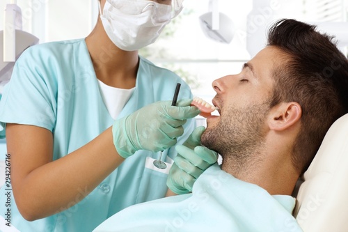 Young man at dental surgeon