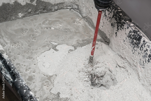 screed fill. mix the solution to fill the floor. liquid floors. interfere with cement for repair with a perforator