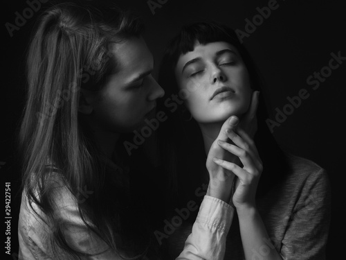 Beautiful couple posing in a studio. Black and white
