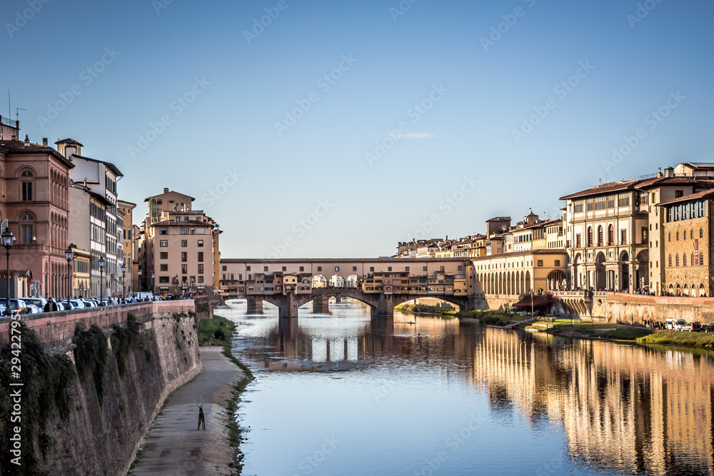 View from the banks of the river Arno on the Ponte Vecchio, Florence, Italy