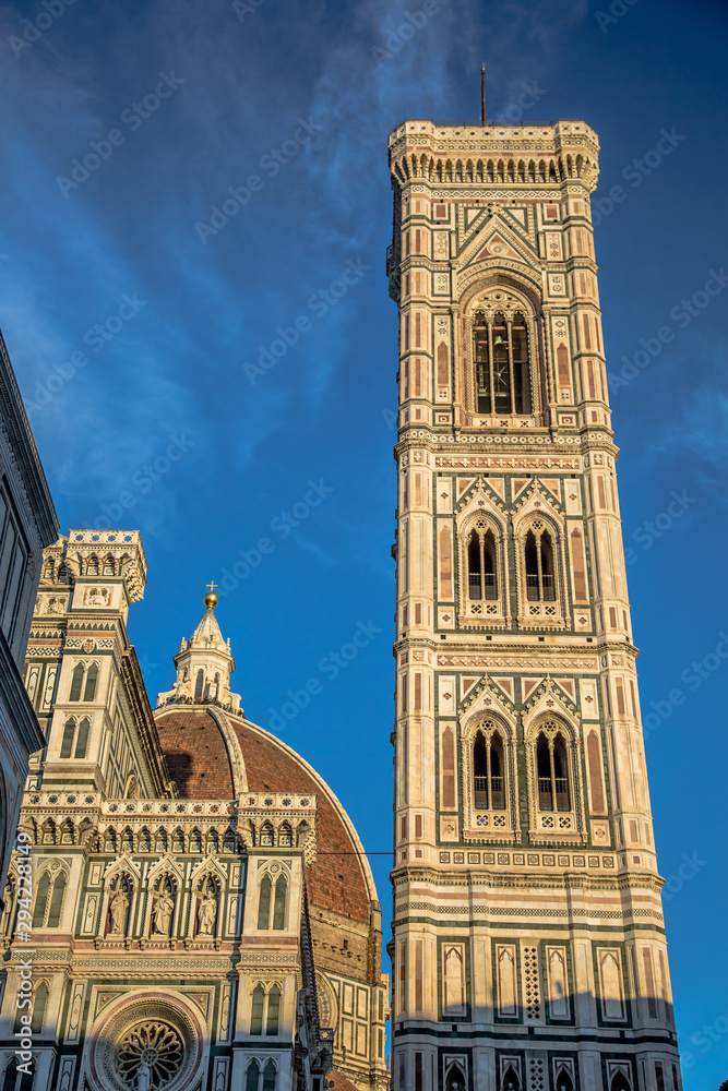 Cathedral of Santa Maria del Fiore and Giotto's Campanile against the blue sky, in Florence. Tuscany, Italy
